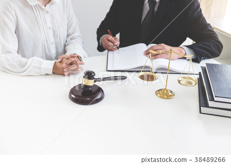 Close up of gavel, Male lawyer or judge Consult with client and 38489266