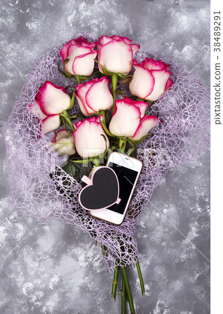 composed of the roses and mobile phone adn 38489291