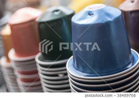 colorful metallic capsules of espresso coffee  38489708