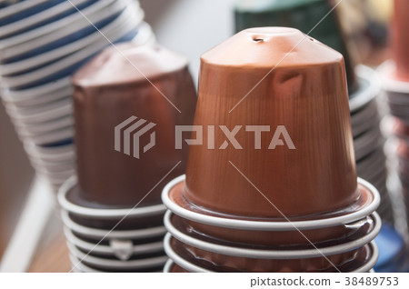 colorful metallic capsules of espresso coffee  38489753