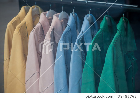 jacket collection on hanger in fashion store jacket collection on hanger in fashion store 38489765