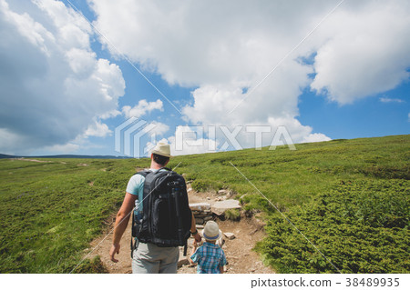 Father and son traveling in Rila mountains Father and son traveling in Rila mountains 38489935