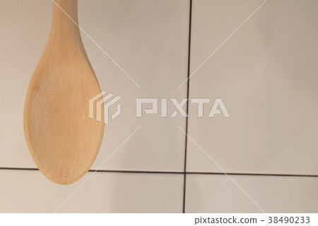 Wooden Spatula or Ladle Hanging on The Wall Wooden Spatula or Ladle Hanging on The Wall 38490233