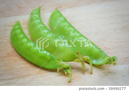 Delicious Sweet Green Pea on Wooden Cutting Board Delicious Sweet Green Pea on Wooden Cutting Board 38490277
