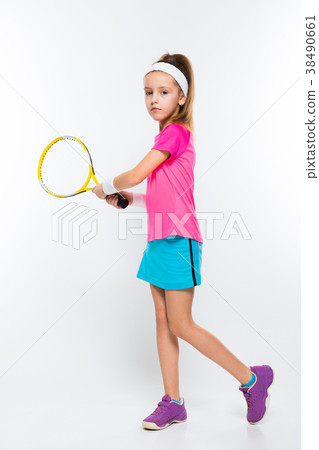 Cute little girl with tennis racket in her hands Cute little girl with tennis racket in her hands 38490661