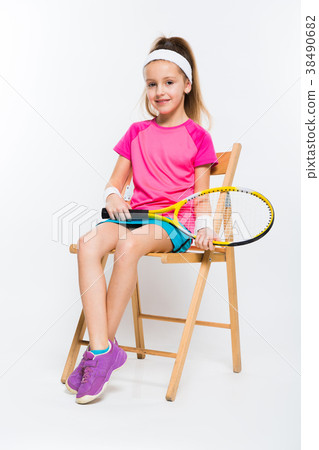Cute little girl with tennis racket in her hands 38490682