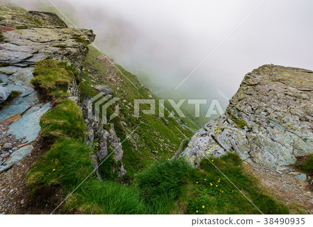 rocky cliffs in foggy weather rocky cliffs in foggy weather 38490935