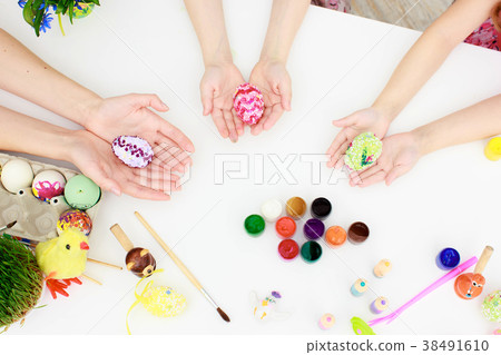 Happy family preparing for Easter Happy family preparing for Easter 38491610