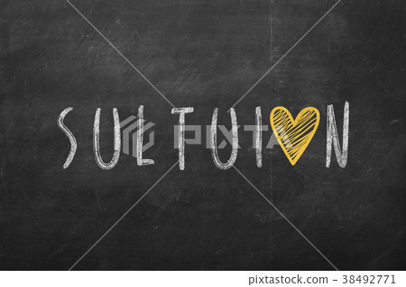 solution text hand-written on black chalkboard 38492771
