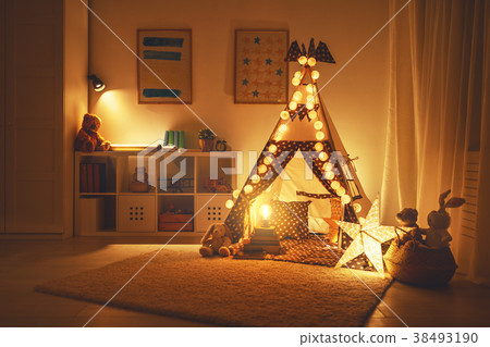 interior of children's playroom with tent, lamps and toys in dar 38493190