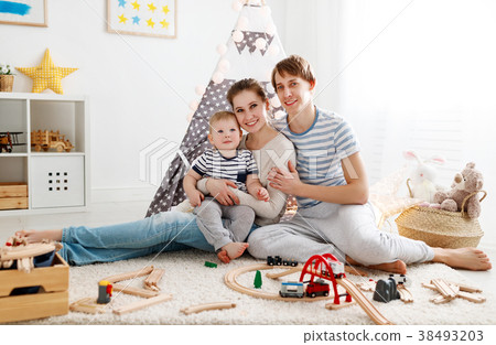 family mother father and   son playing together in children's pl 38493203