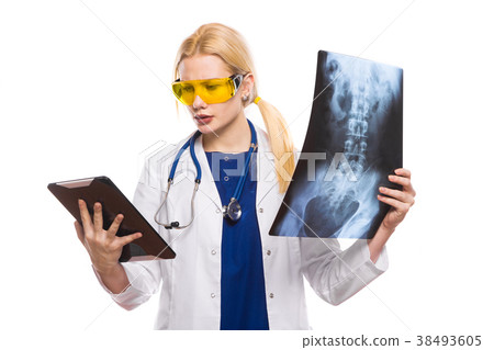 Woman doctor with X-ray and tablet Woman doctor with X-ray and tablet 38493605