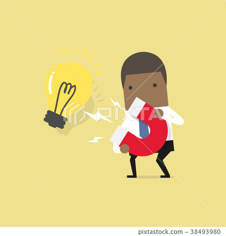 African businessman attracting light bulbs. 38493980