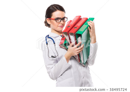 Angry young woman doctor with stethoscope holding 38495724