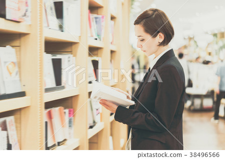 Choosing a Book (Reading) Young Woman Title Change 38496566