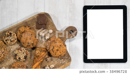 Fresh homemade cookies with tablet 38496728