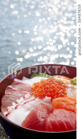 Bowl of rice topped with sashimi Bowl of rice topped with sashimi 38497659
