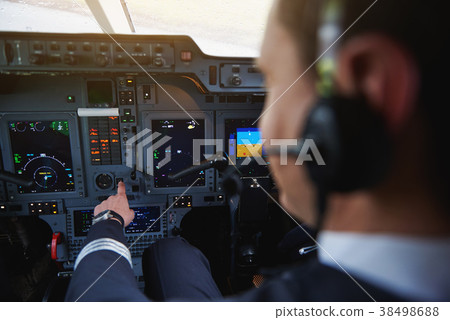Aviator hand working with aircraft appliance 38498688