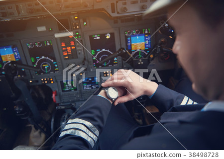 Aviator checking time on arm 38498728