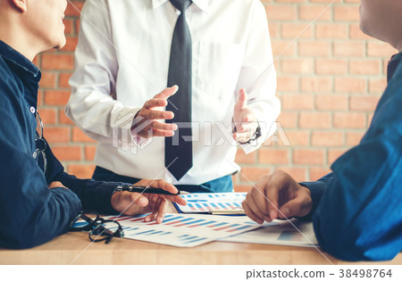 Business team discussing in creative meeting Business team discussing in creative meeting 38498764