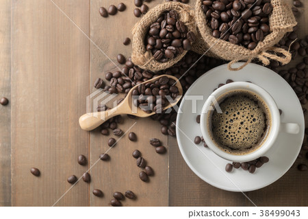 Hot black coffee on cup and roasted coffee beans 38499043