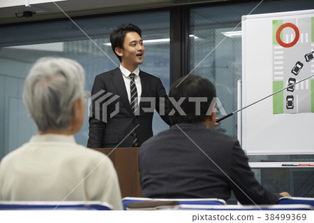 Senior taking a lecture 38499369