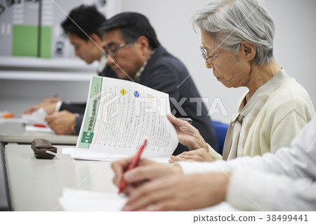 Senior taking a lecture 38499441