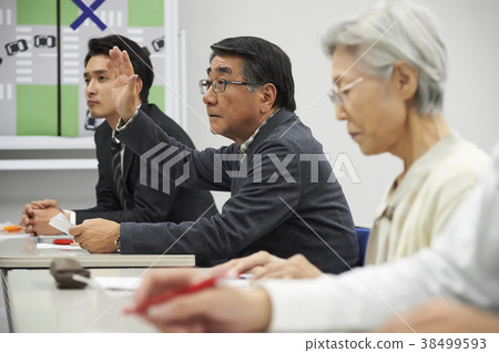 Senior taking a lecture 38499593