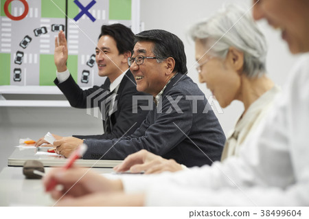 Senior taking a lecture 38499604