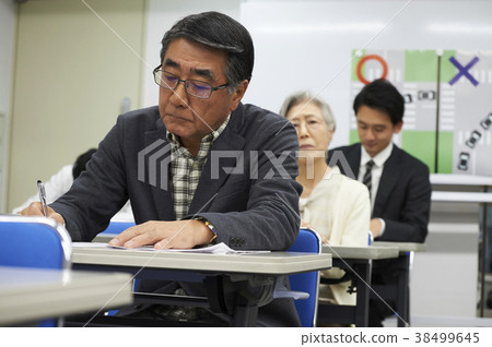 Senior taking a lecture 38499645