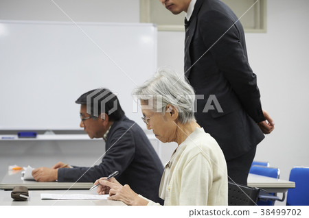 Senior taking a lecture 38499702