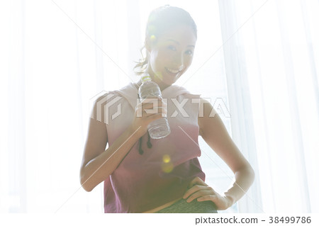 Woman doing fitness at home Woman doing fitness at home 38499786