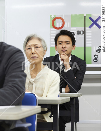 Senior taking a lecture 38499824