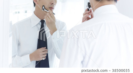 A man getting dressed A man getting dressed 38500035