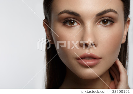 Voluptuous young woman likes her facial skin Voluptuous young woman likes her facial skin 38500191