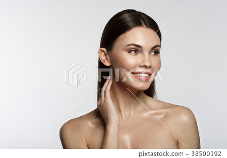 Cheerful girl enjoying skincare treatment Cheerful girl enjoying skincare treatment 38500192