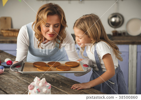 Satisfied females enjoying the smell of baking Satisfied females enjoying the smell of baking 38500860