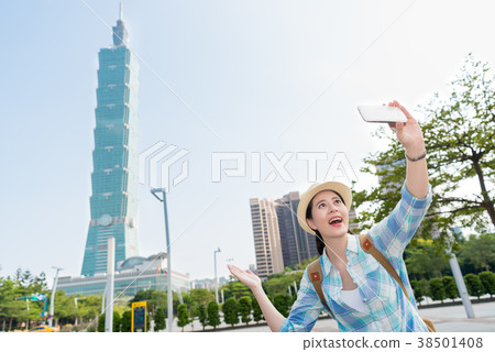 Girl selfie in front of Taipei 101. Girl selfie in front of Taipei 101. 38501408