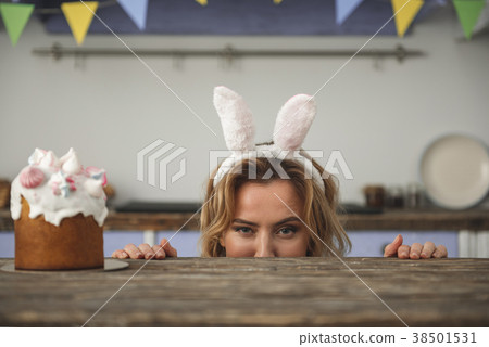 Sly woman scheming to steal delicious dessert Sly woman scheming to steal delicious dessert 38501531