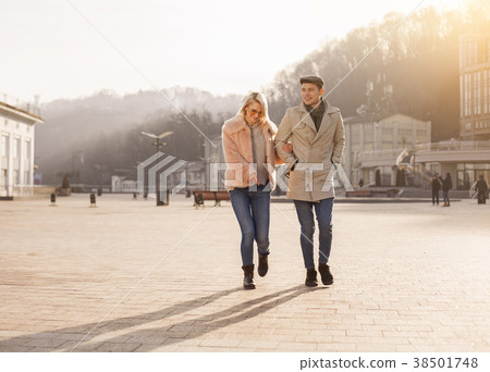 Optimistic couple is enjoying time together on Optimistic couple is enjoying time together on 38501748