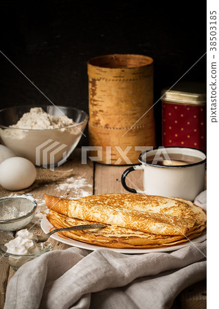 Stack of crepes and ingredients for cooking  38503185