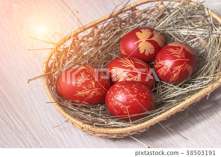 Easter eggs laying in wicker wooden basket  38503191