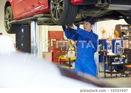 Car maintenance pit mechanic Car maintenance pit mechanic 38503497