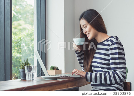 Asian woman using on laptop computer 38503876