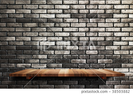 Empty wood board shelf at black brick wall 38503882