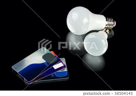 energy-saving LED bulb and credit cards 38504143