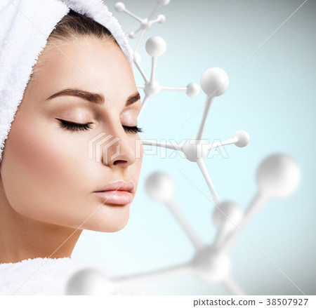 Young sensual woman with big white molecule chain. 38507927