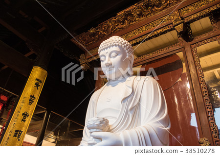 close-up of Buddhist God statue in the ancient close-up of Buddhist God statue in the ancient 38510278