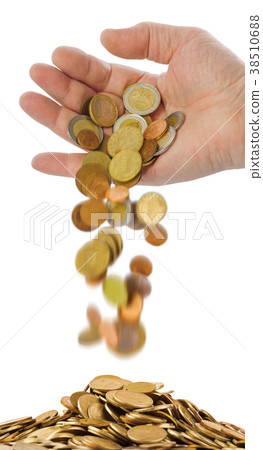 Hand and falling coins 38510688