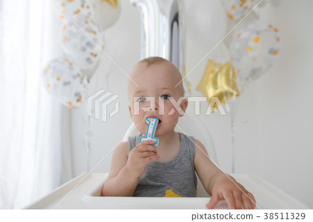 Baby boy celebrating first birthday Baby boy celebrating first birthday 38511329